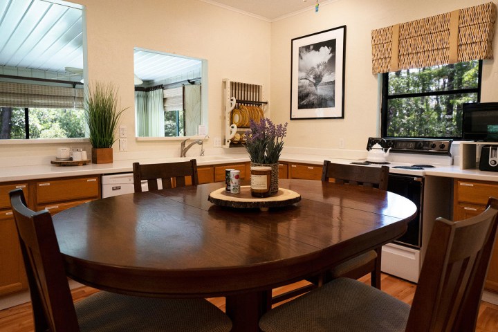 a living room with a table in front of a window
